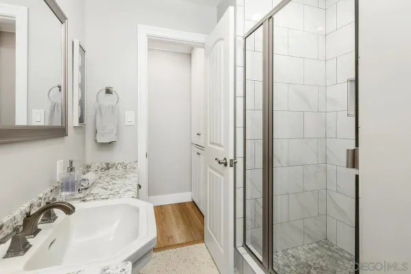 a bathroom with a sink and mirror