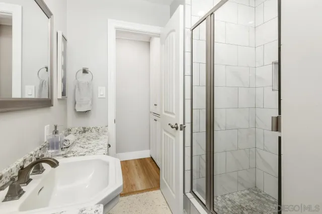 a bathroom with a sink and mirror