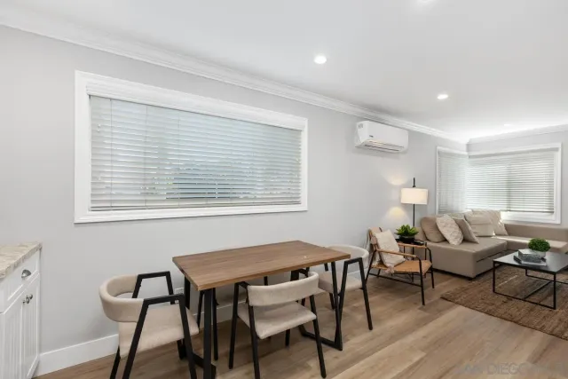 a view of a livingroom with furniture and a window