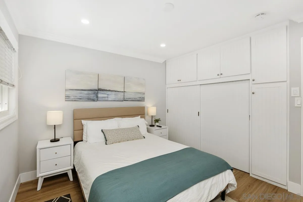 852 Olive Avenue Coronado, CA 92118 - Photo 8 of 12 a bedroom with a bed and a window