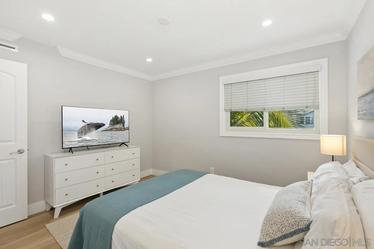 852 Olive Avenue Coronado, CA 92118 - Photo 9 of 12 a bedroom with a bed and window