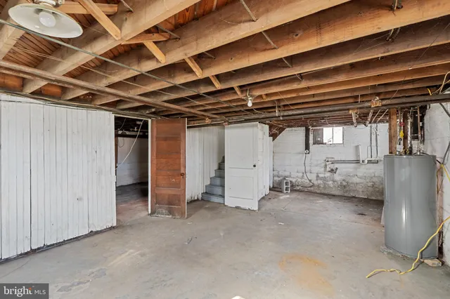 a view of empty room with wooden walls
