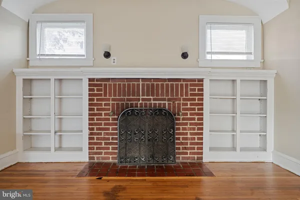 a view of a fireplace with wooden floor