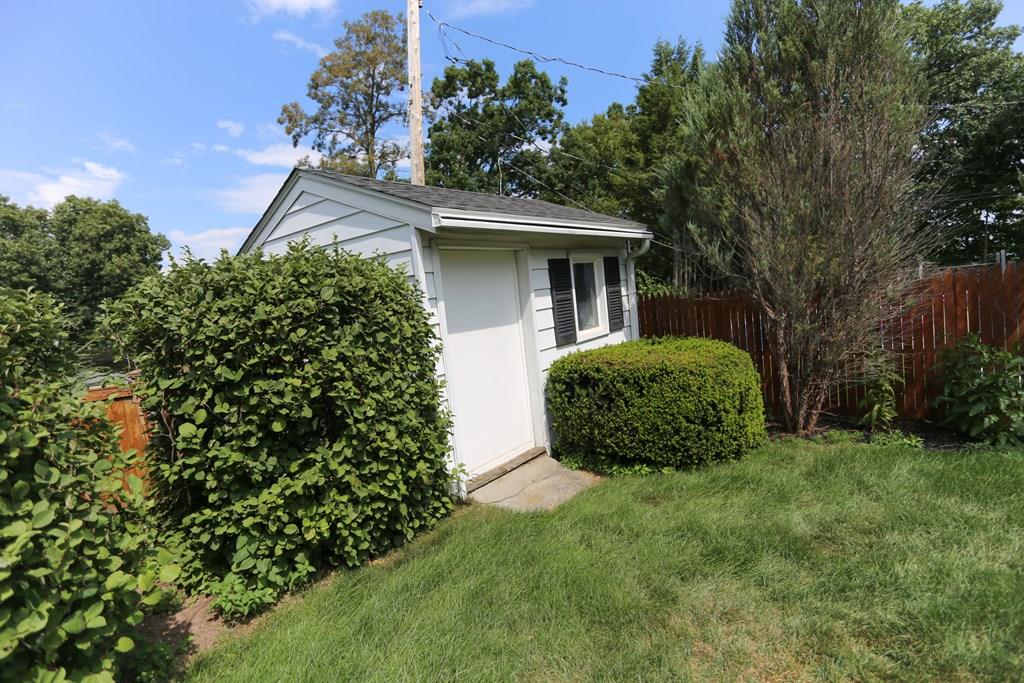 94 Hillview Road Holyoke, MA 01040 - Photo 3 of 9 a view of a house with a small yard and a garden