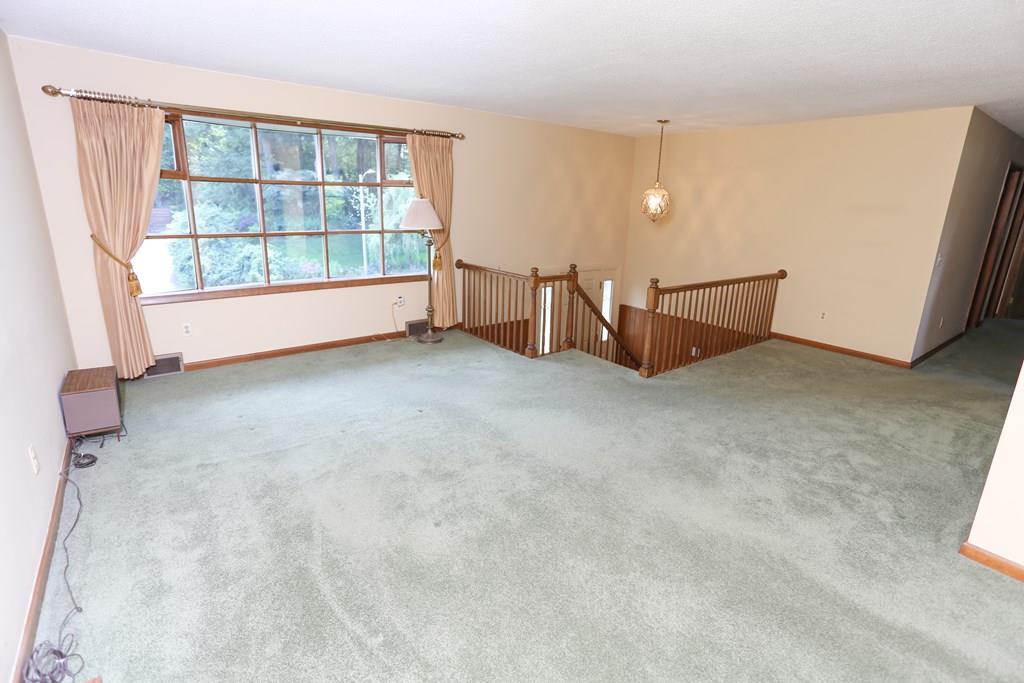 94 Hillview Road Holyoke, MA 01040 - Photo 4 of 9 an empty room with windows