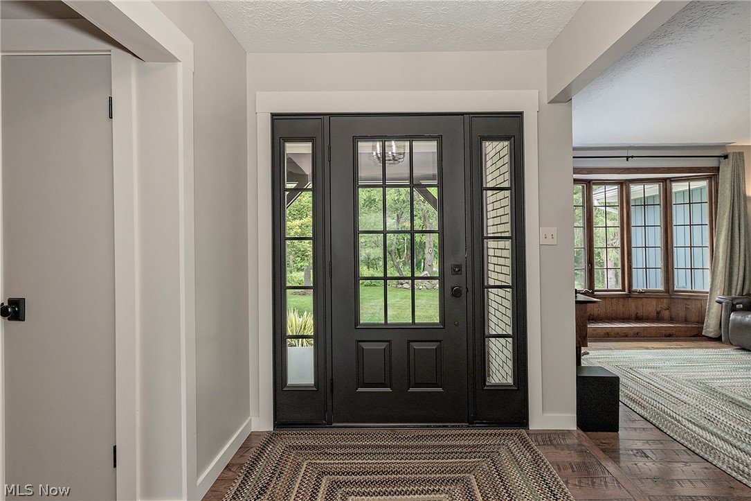 11292 Butternut Road Chardon, OH 44024 - Photo 6 of 49 Black paneled front door with divided lites and sidelights