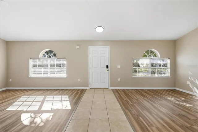 a view of an empty room with a window