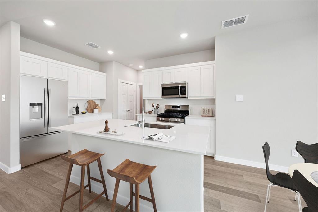 1216 Bellflower Road Lavon, TX 75166 - Photo 5 of 27 Kitchen in the Mesquite home plan by Trophy Signature Homes – REPRESENTATIVE PHOTO