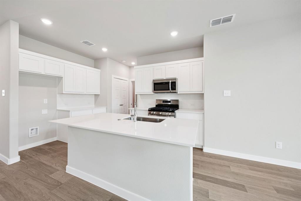 1216 Bellflower Road Lavon, TX 75166 - Photo 6 of 27 Kitchen in the Mesquite home plan by Trophy Signature Homes – REPRESENTATIVE PHOTO