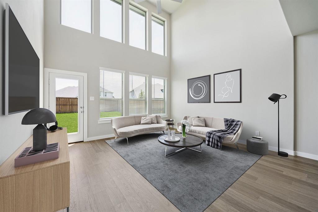 1216 Bellflower Road Lavon, TX 75166 - Photo 10 of 27 Living Room in the Mesquite home plan by Trophy Signature Homes – REPRESENTATIVE PHOTO