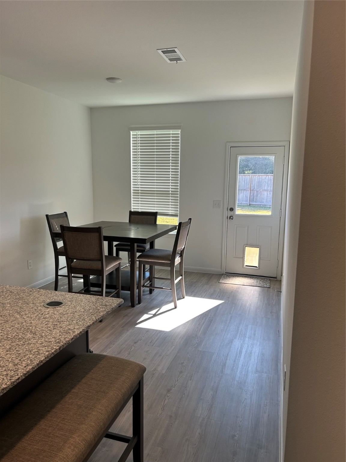 23415 Weir Box Road Hockley, TX 77447 - Photo 19 of 35 a view of a dining room with furniture and wooden floor