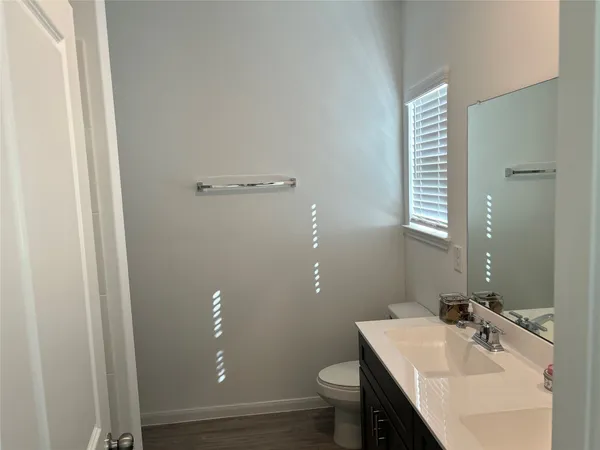 a view of a bathroom from the hallway