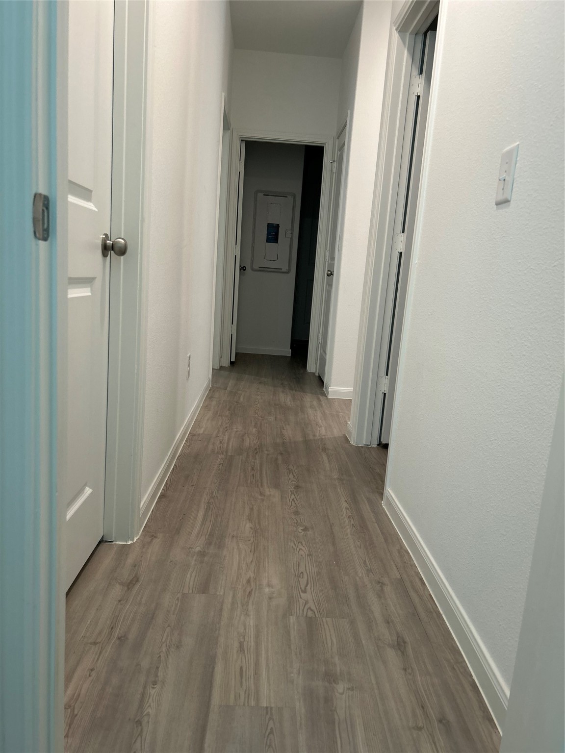 23415 Weir Box Road Hockley, TX 77447 - Photo 30 of 35 a view of a hallway with wooden floor