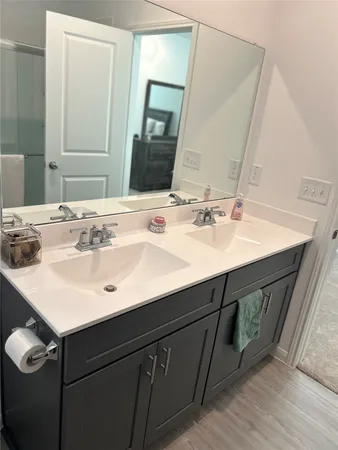 a bathroom with a sink and a mirror