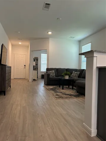 a living room with a couch and a flat screen tv