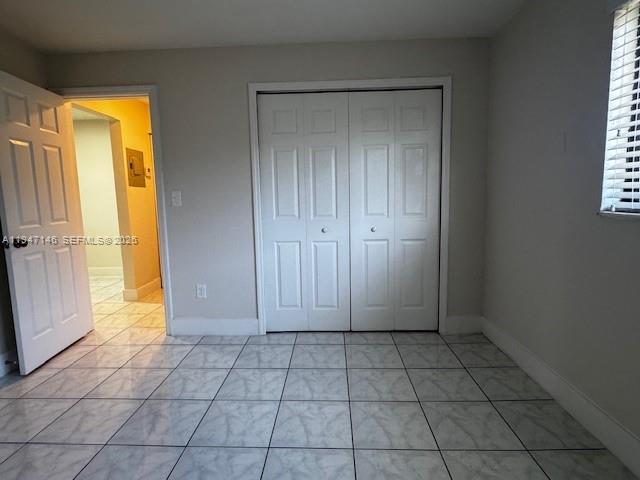 1310 West 29th Street, Unit 28 Hialeah, FL 33012 - Photo 4 of 12 a view of an empty room and window
