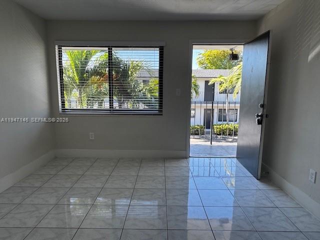 1310 West 29th Street, Unit 28 Hialeah, FL 33012 - Photo 8 of 12 a view of an entryway with a window