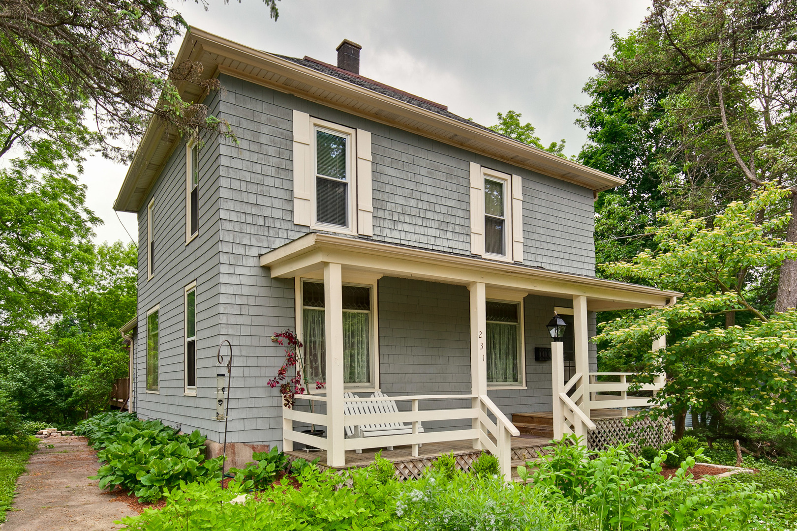 231 Spring Street Cary, IL 60013 - Photo 1 of 20 front view of a house with a yard