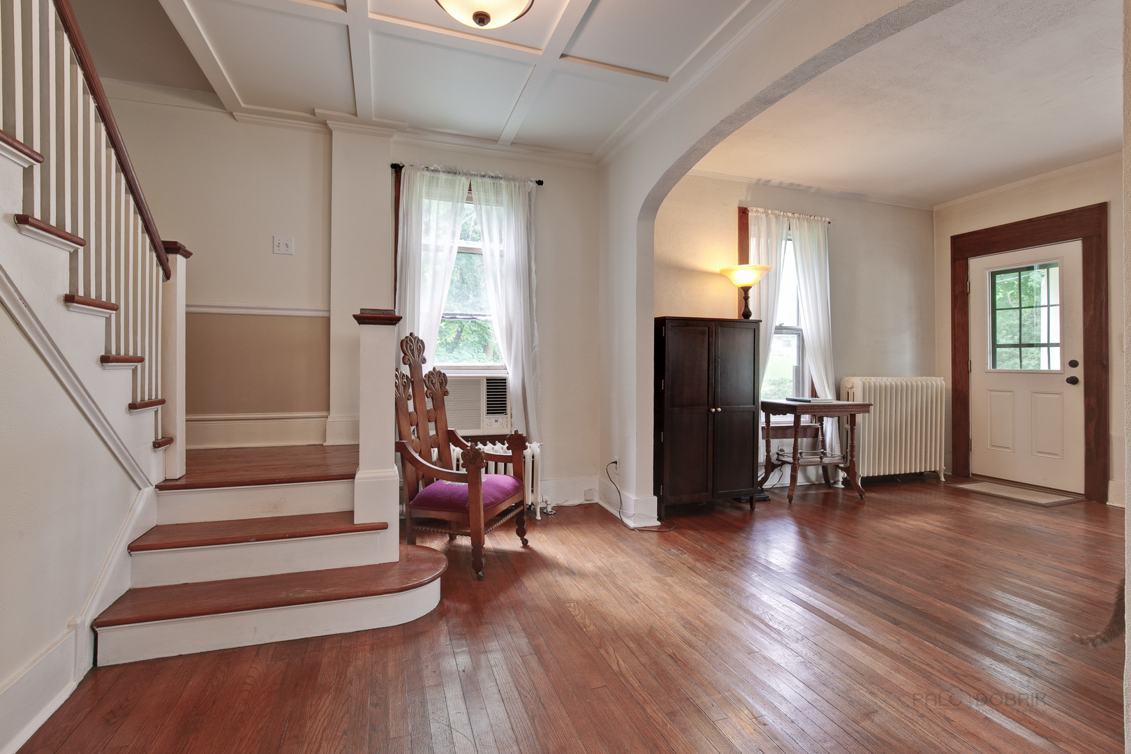 231 Spring Street Cary, IL 60013 - Photo 3 of 20 a view of a livingroom with wooden floor and furniture