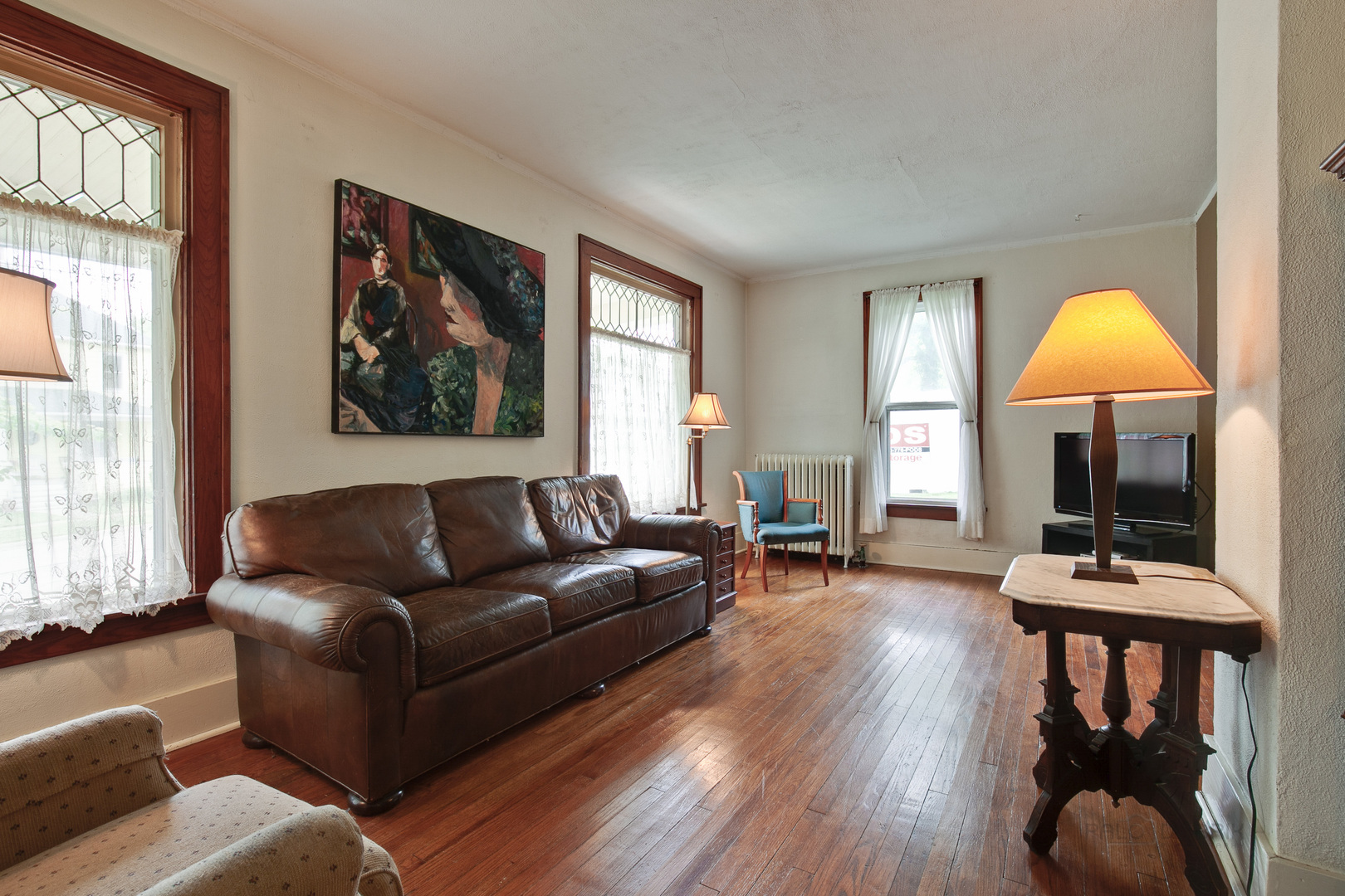 231 Spring Street Cary, IL 60013 - Photo 6 of 20 a living room with furniture fireplace and window