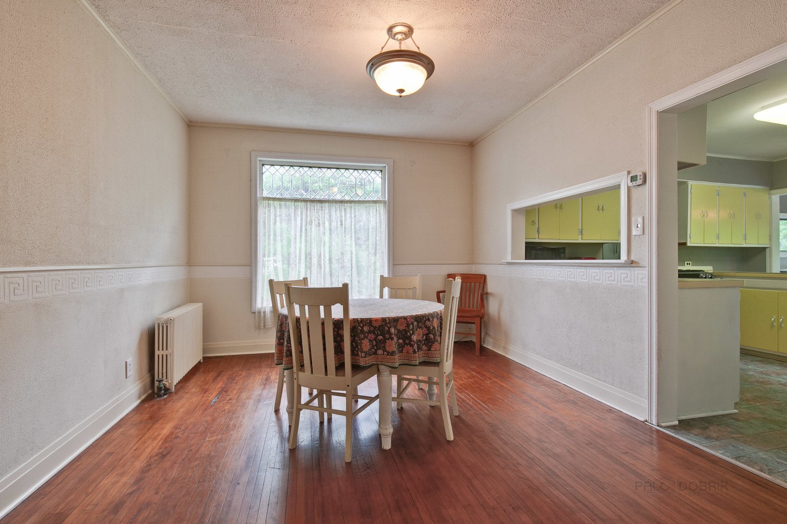 231 Spring Street Cary, IL 60013 - Photo 7 of 20 a view of a dining room with furniture window and wooden floor