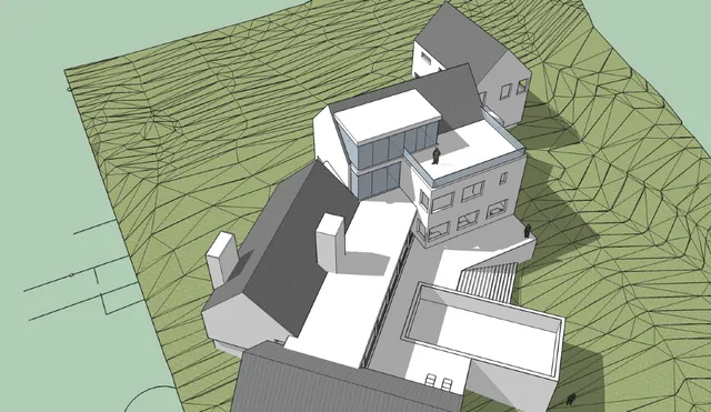 an aerial view of a house with table and chairs