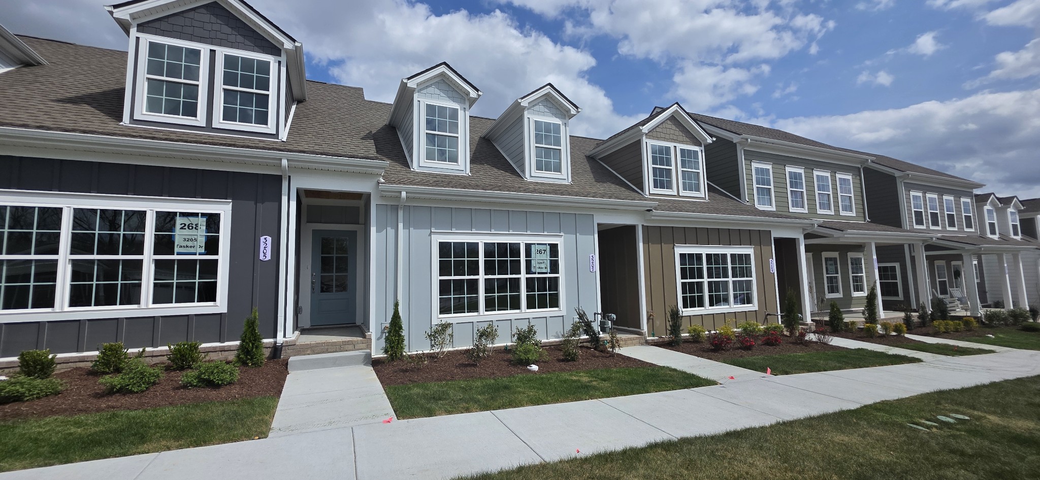 3207 Tasker Drive Antioch, TN 37013 - Photo 3 of 21 front view of a brick house with a yard
