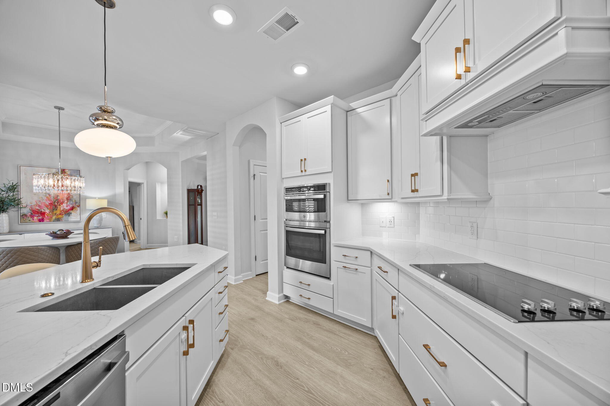 1405 Rich Inlet Cary, NC 27519 - Photo 11 of 44 a kitchen with stainless steel appliances a sink a stove and cabinets