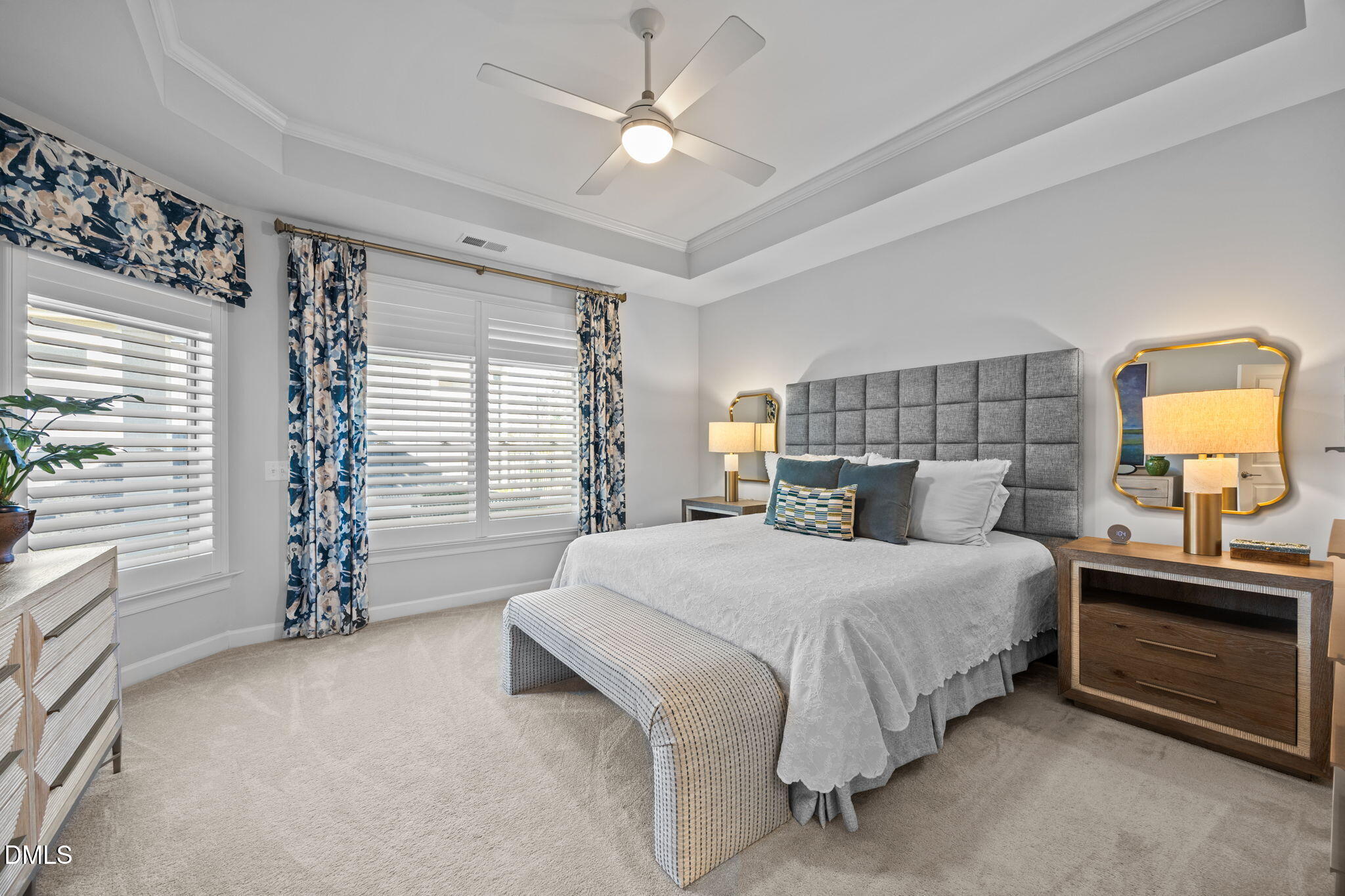 1405 Rich Inlet Cary, NC 27519 - Photo 14 of 44 a bedroom with a bed and a chandelier