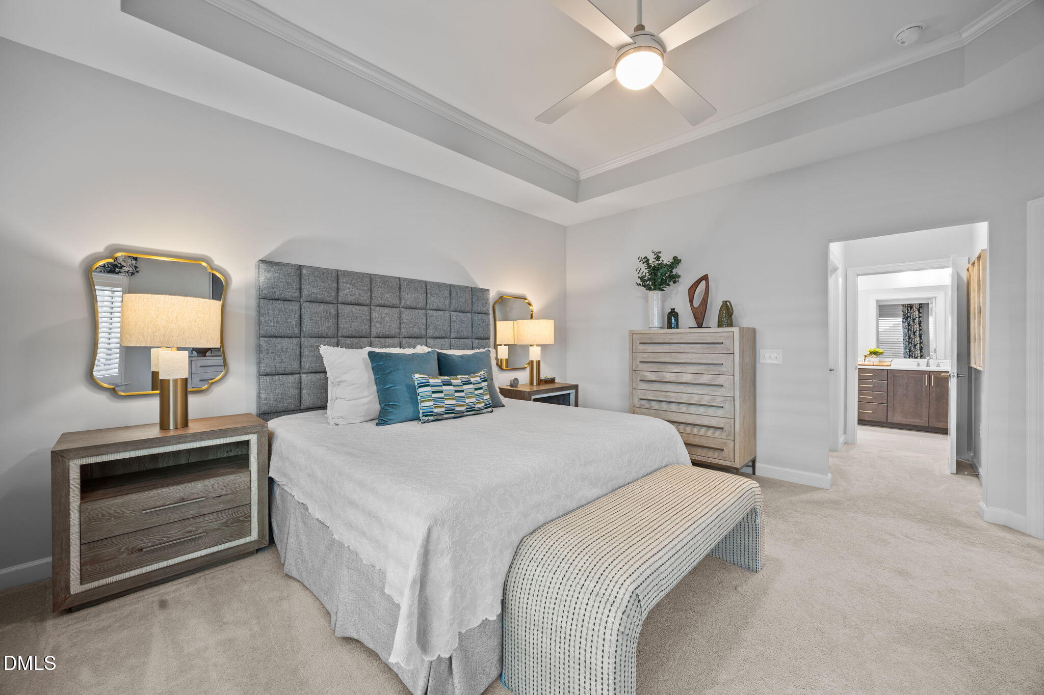 1405 Rich Inlet Cary, NC 27519 - Photo 15 of 44 a bedroom with a bed and a chandelier