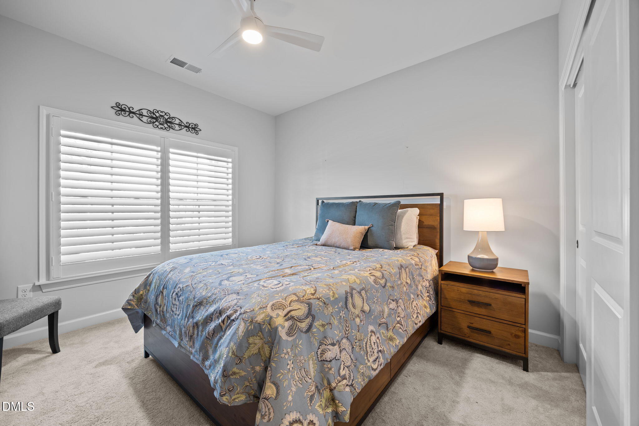 1405 Rich Inlet Cary, NC 27519 - Photo 19 of 44 a bedroom with a bed and a window