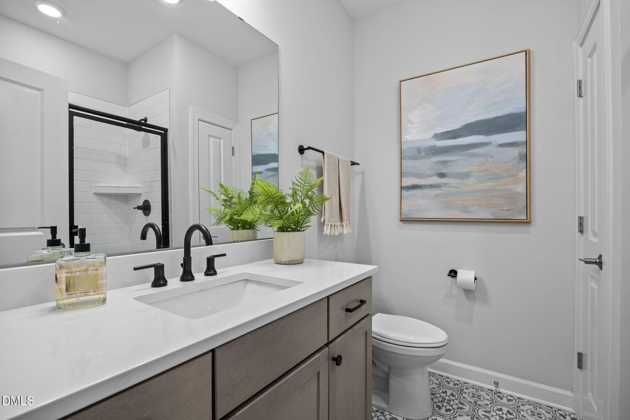 1405 Rich Inlet Cary, NC 27519 - Photo 20 of 44 a bathroom with a toilet sink and mirror