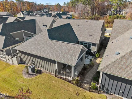 an aerial view of a house with swimming pool and mountain view