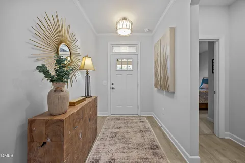 a view of hallway with wooden floor