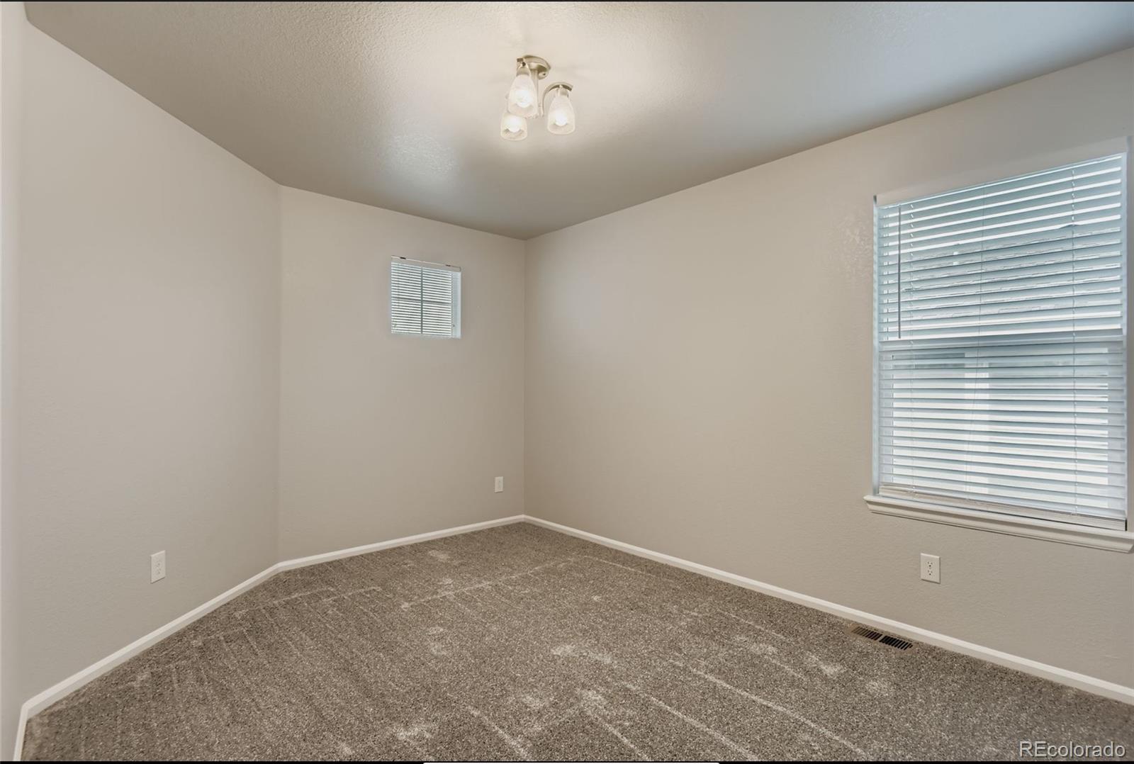 10726 Middlebury Way Highlands Ranch, CO 80126 - Photo 17 of 30 an empty room with a window