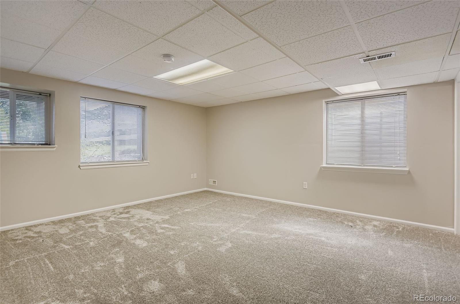 10726 Middlebury Way Highlands Ranch, CO 80126 - Photo 20 of 30 an empty room with windows