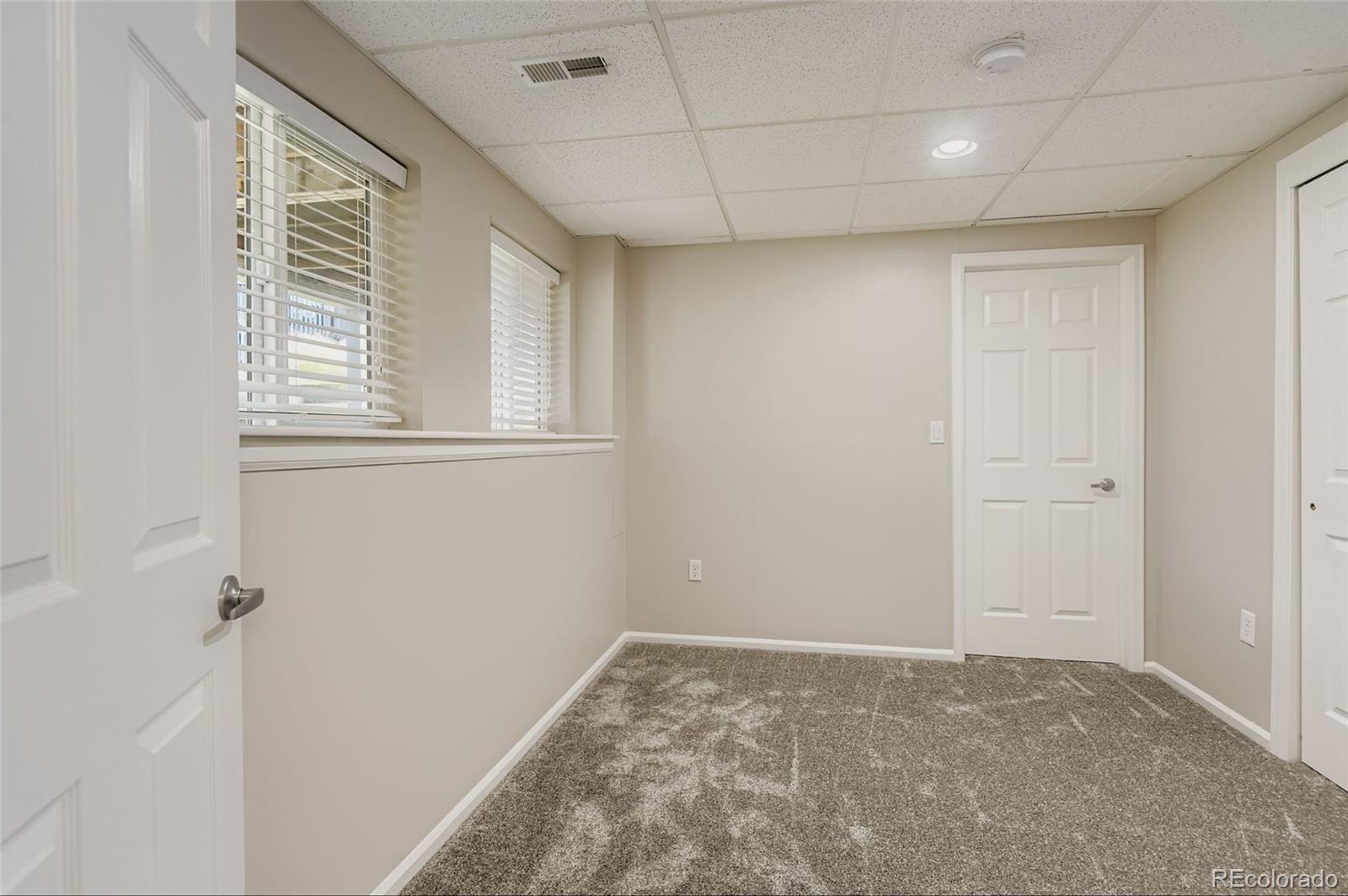 10726 Middlebury Way Highlands Ranch, CO 80126 - Photo 21 of 30 a view of an empty room with a window