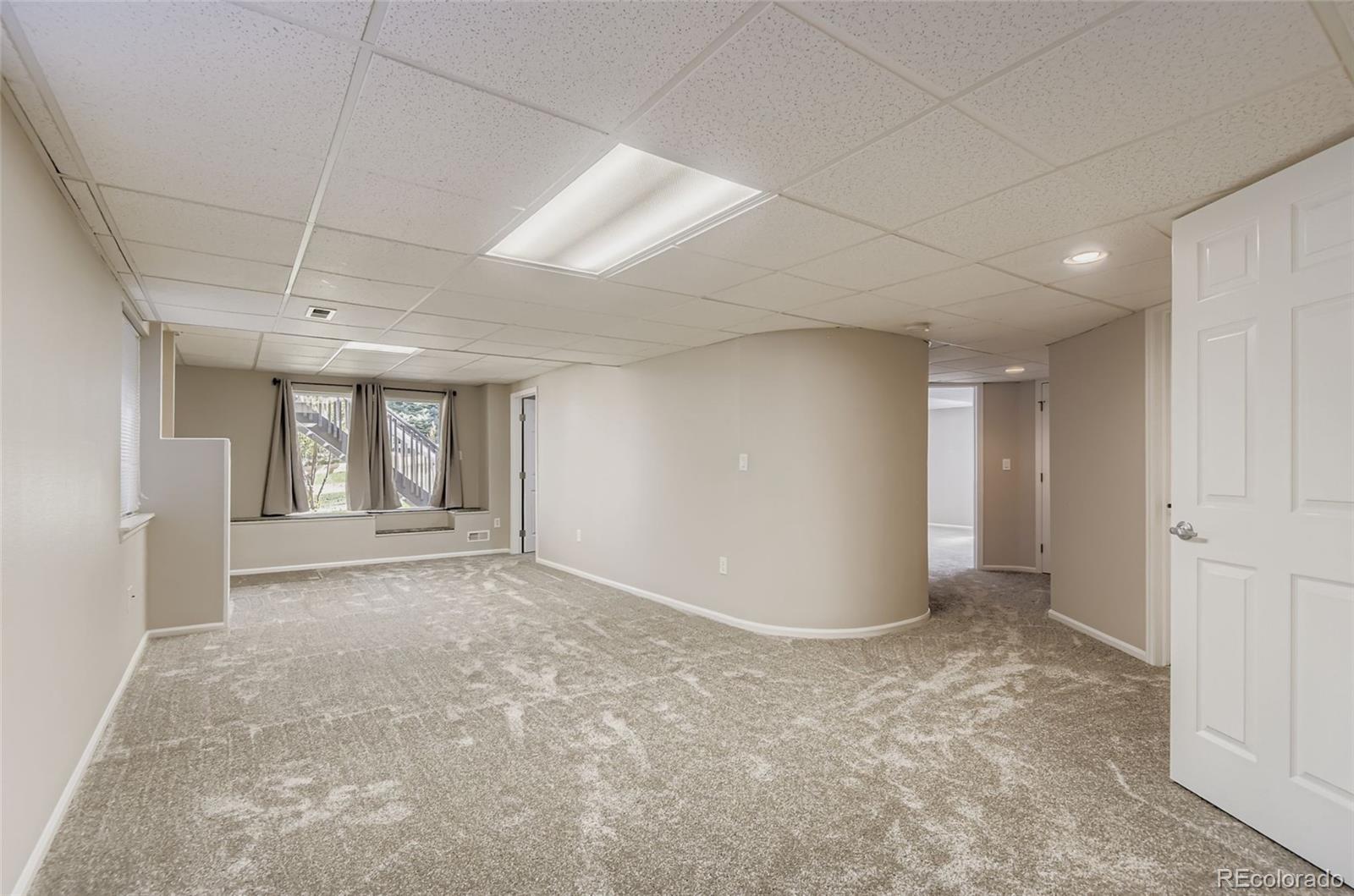 10726 Middlebury Way Highlands Ranch, CO 80126 - Photo 23 of 30 a view of an empty room with a window