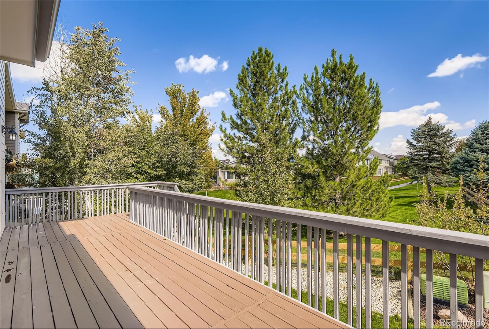 10726 Middlebury Way Highlands Ranch, CO 80126 - Photo 24 of 30 a view of balcony with wooden floor and fence