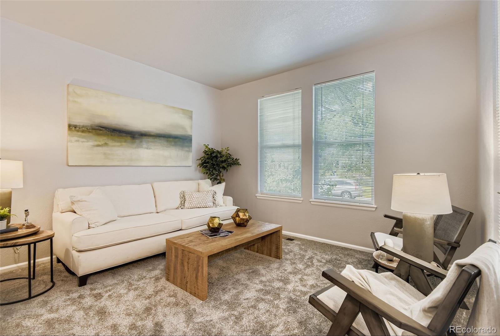 10726 Middlebury Way Highlands Ranch, CO 80126 - Photo 4 of 30 a living room with furniture and a window