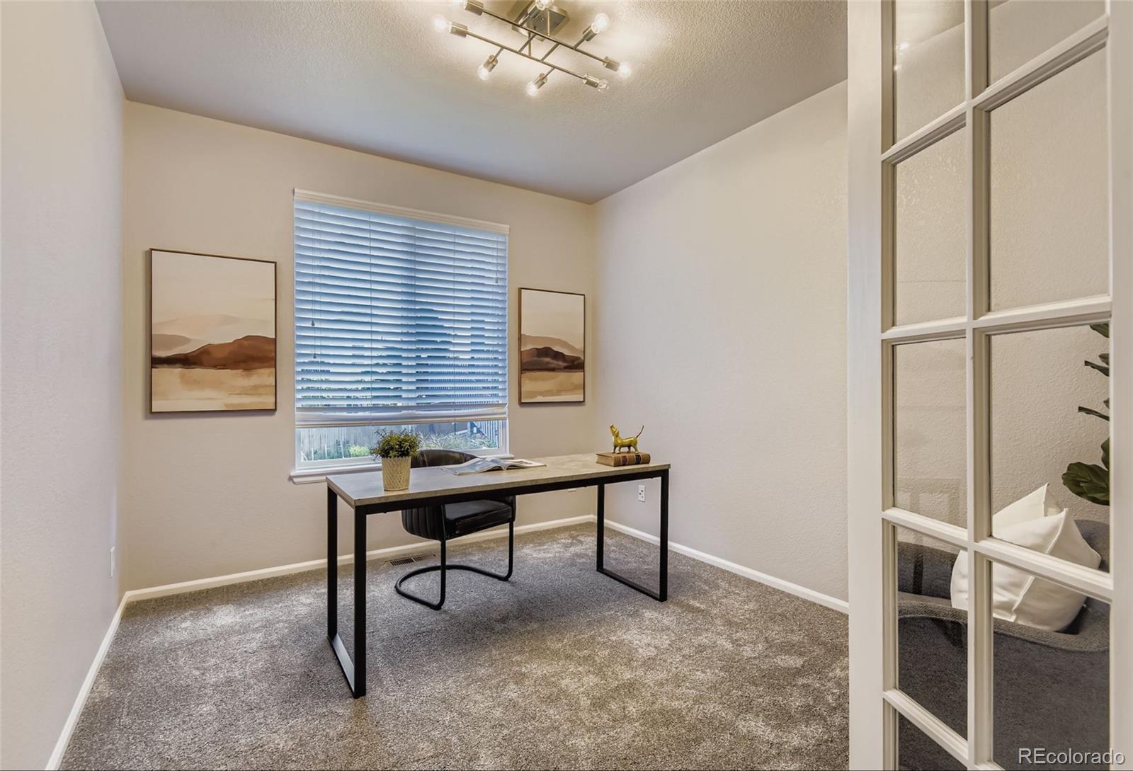 10726 Middlebury Way Highlands Ranch, CO 80126 - Photo 10 of 30 a view of a workspace with furniture