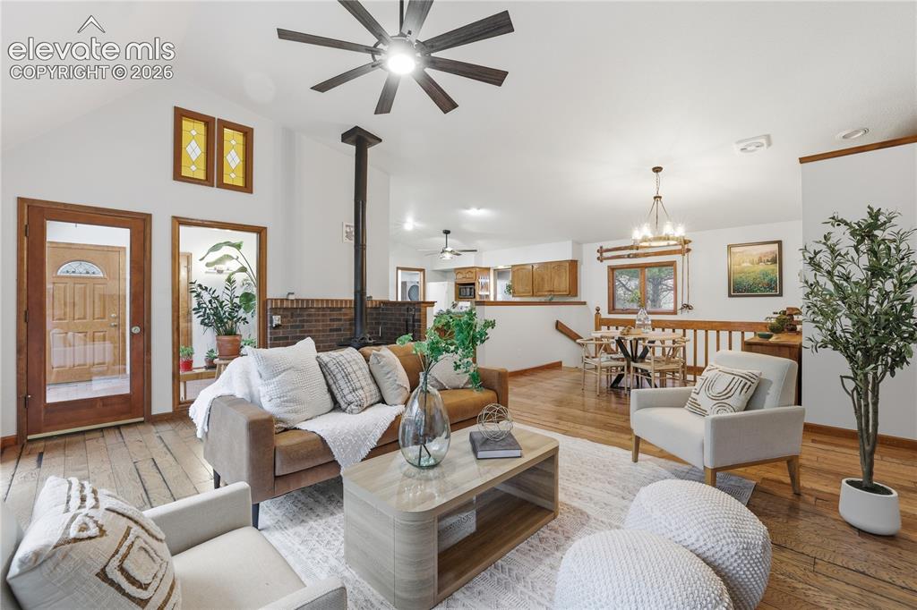 18190 Forest View Road Monument, CO 80132 - Photo 9 of 50 a living room with furniture and wooden floor
