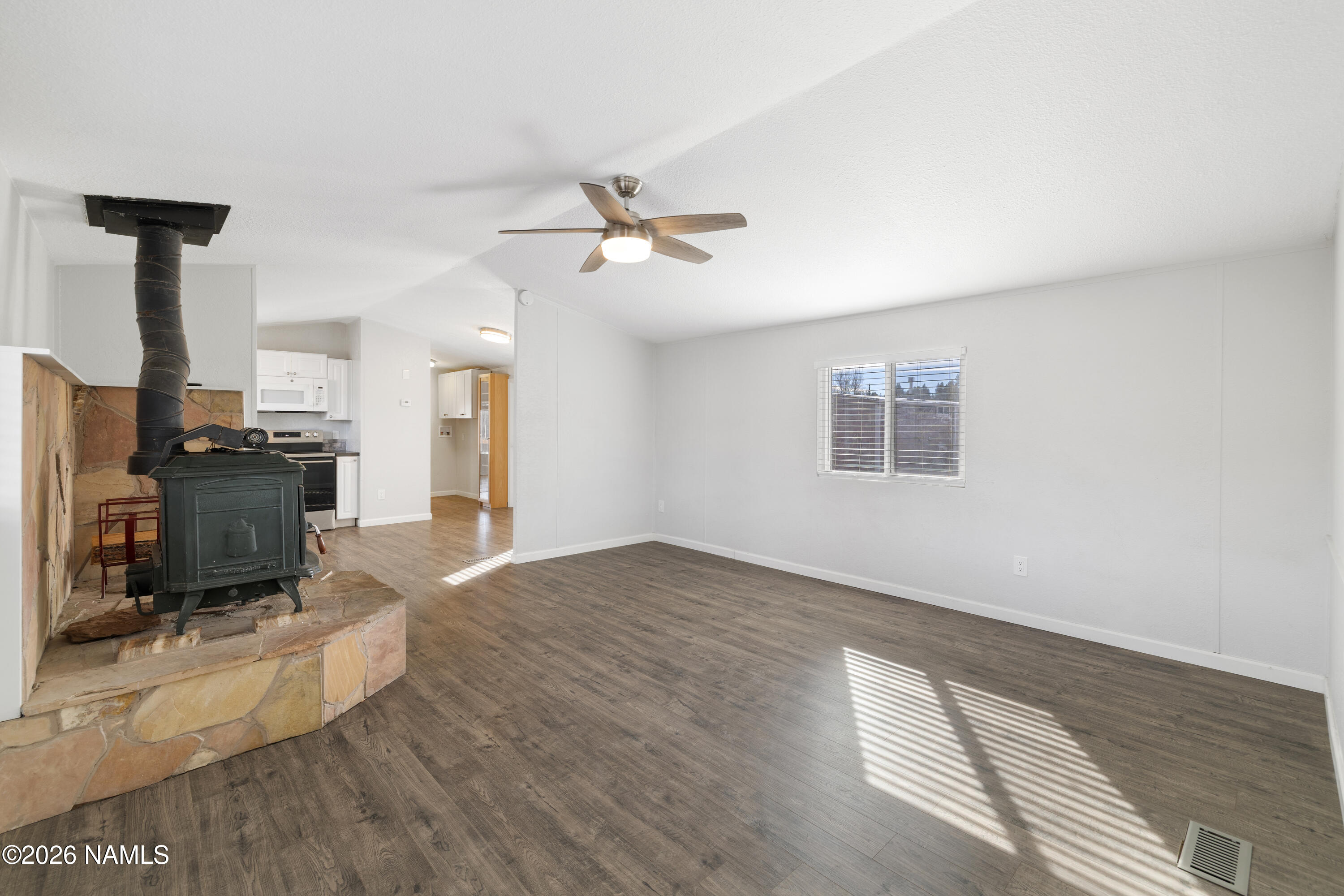 4805 South Thorn Road, Unit 8 Flagstaff, AZ 86005 - Photo 12 of 38 Living Room + Wood Burning Stove