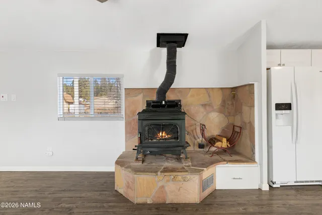 a view of fireplace with wooden floor