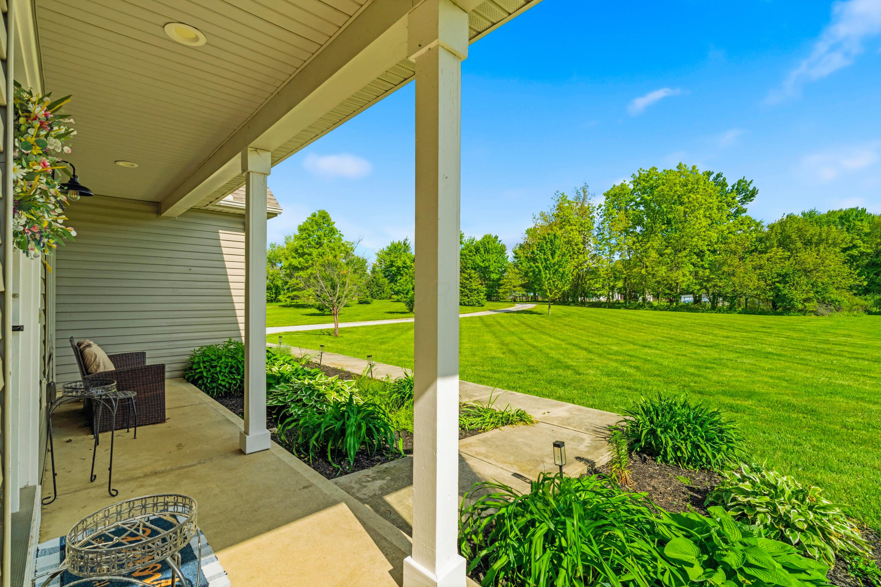 8507 Benner Road Johnstown, OH 43031 - Photo 3 of 69 Unwind on the front porch, overlooking your yard! Perfect place to start or end the day!
