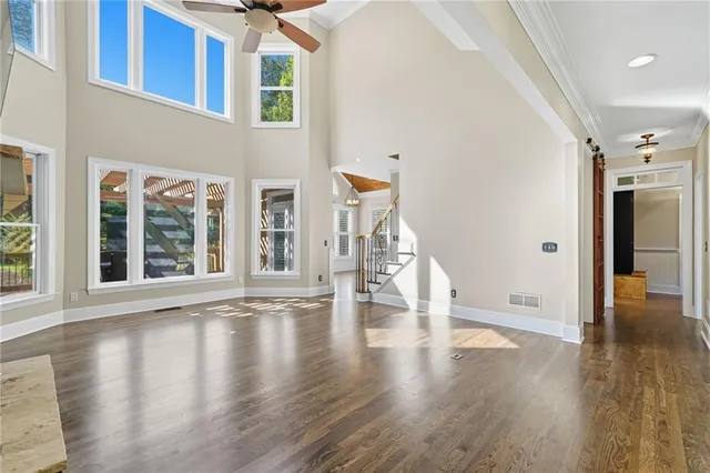 a bathroom with a toilet and a shower curtain