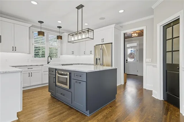 a living room with furniture and a ceiling fan