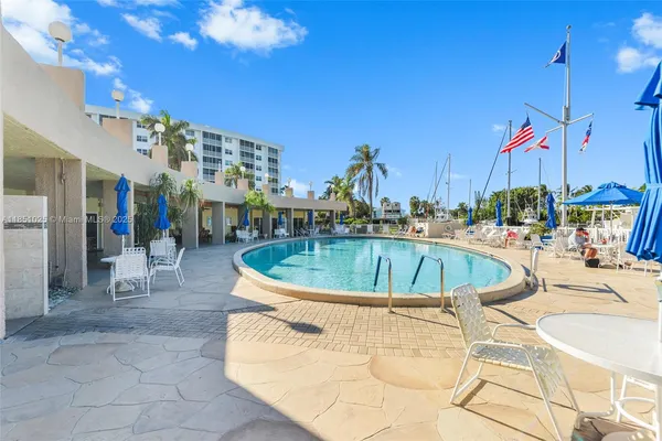 a view of a swimming pool with a lounge chairs