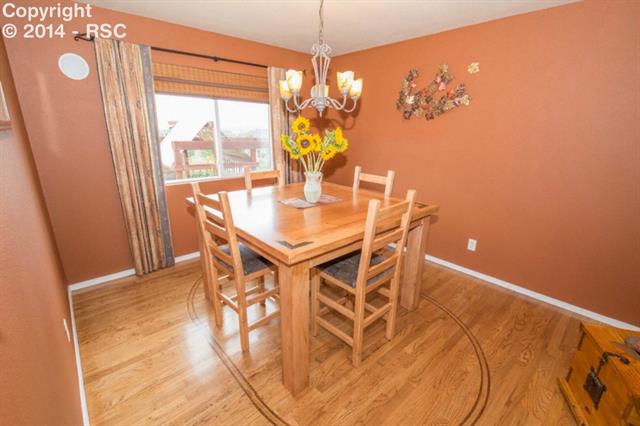 207 Talus Road Monument, CO 80132 - Photo 8 of 19 Dining Room with Custom Inlay Floor