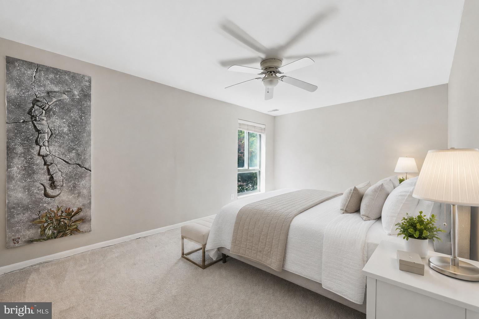 11252 Chestnut Grove Square, Unit 248 Reston, VA 20190 - Photo 11 of 25 Serene bedroom with artistic flair.